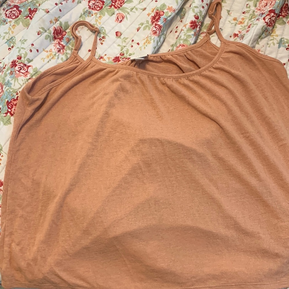 Tank top/peachy color. Good for a nice summer day. Goes with any bottom